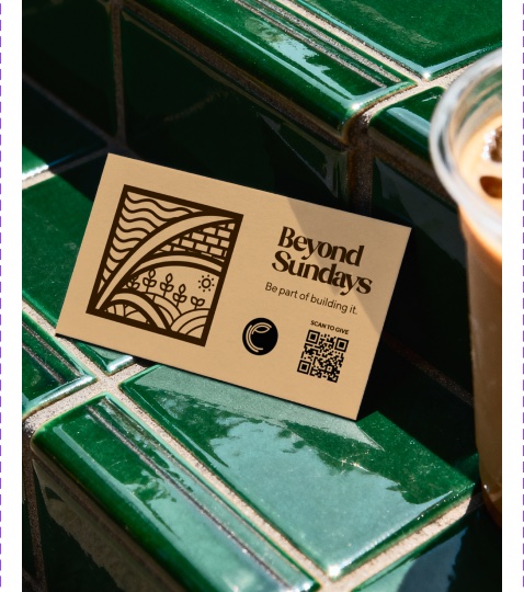 Beyond Sundays card on green tile beside a drink